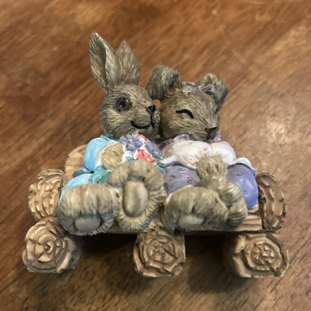 Bunny Couple Figurine vtg anthropomorphic bunnies Hugging couch Bench Flowers